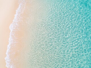 Aerial view of pristine beach with clear turquoise water and gentle sandy shoreline