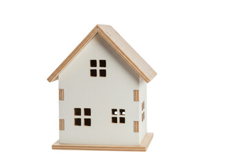 Small white wooden house model with a brown roof isolated on white background