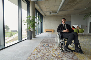 A director in a wheelchair sitting alone in an empty office, deeply reflecting on business...