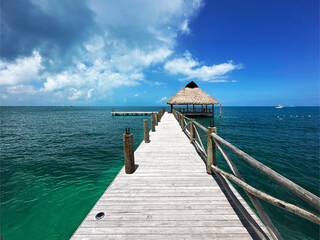 Perspective view from a dock, is a sunny day, with a turquoise sea blue in Isla Mujeres, Quintana Roo.
