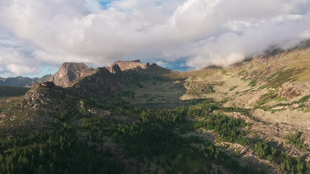 Clouds are passing over the ergaki nature park mountain range