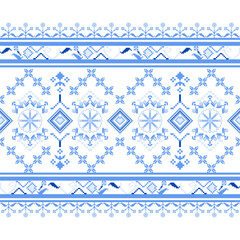 A traditional Ukrainian cross-stitch pattern featuring pixelated floral and geometric repeats in blue, white. Often used in traditional clothing and decorative textiles.