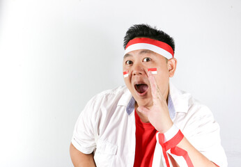 Excited Indonesian fans shouted loudly and wearing red white headband