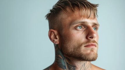 Fototapeta premium A close-up profile of a man with a beard and striking blue eyes, conveying depth and contemplation, perfect for themes of introspection and masculinity.