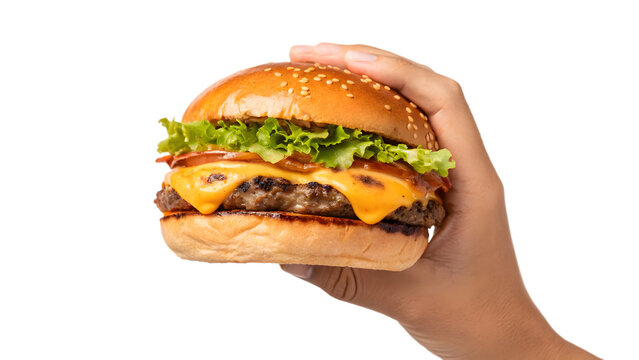 A hand holds a cheeseburger with beef, lettuce, and tomato on a burger bun