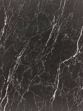 Dark marble texture; black background with white veining.