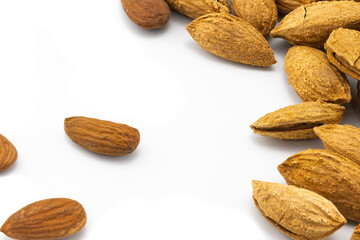 Almonds in shell and almond peeled isolated on white background. Selective focus