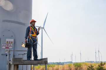 Person with wind turbine in the field. engineer with turbine in the wind. engineer with turbine