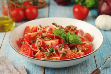 A bowl with Romanian tomato salad de Rosii	