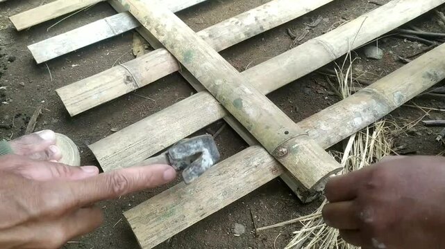 carpenter hammering nails into wood