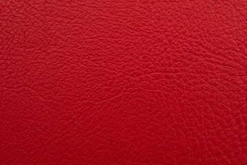 Background made of genuine red leather. Material. Texture of colored leather
