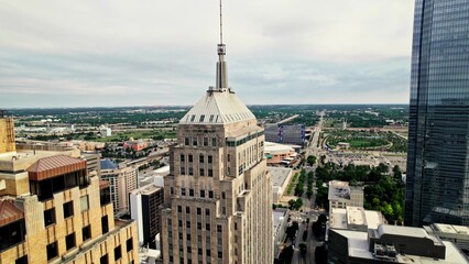 Obraz premium Skyscrapers on the outskirts of an American city. Drone view of the skyscraper spire. A sunny summer day