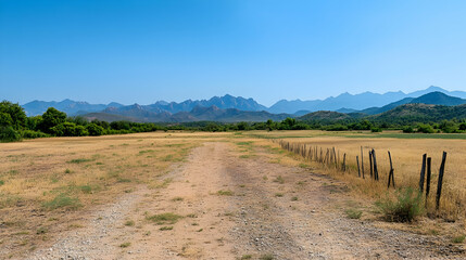 Obraz premium Desert road leading to mountains under a clear blue sky. Use Travel brochure, landscape photography
