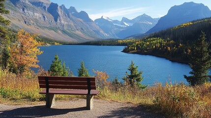 Obraz premium A wooden bench overlooking a scenic lake surrounded by mountains. pic