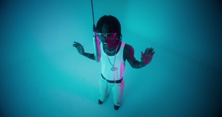 Top view of the singing and dancing rapper. Studio video