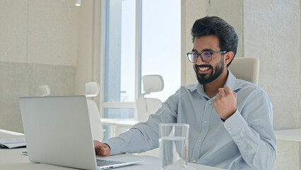 Happy Arabian man Indian muslim businessman employer professional manager office worker work laptop...