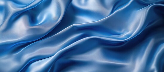 Obraz premium Blue silk fabric with smooth and elegant texture folds.