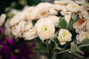 Floral background with artificial flowers close-up.