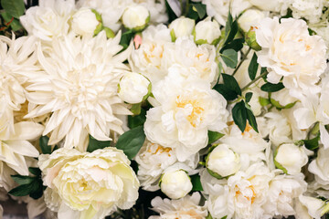 Floral background with artificial flowers close-up.