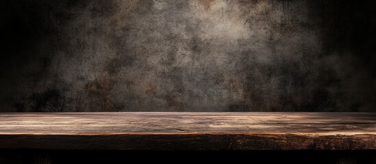 Empty rustic wooden table against dark textured background with copy space.
