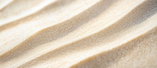 Close-up of wavy sand texture with soft natural shadows