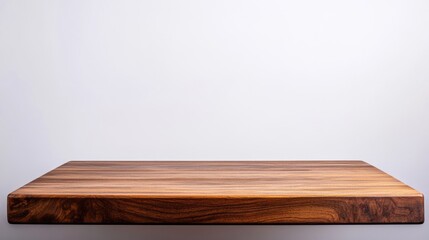 Empty wooden tabletop against plain background with copy space