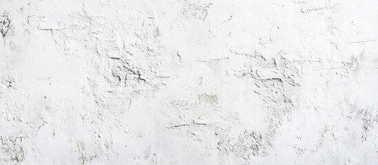 Obraz premium Grungy white textured plaster wall background with subtle cracks and irregularities