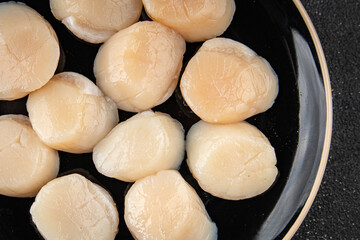 Sea scallop raw seafood fresh tasty food dish gourmet food background on the table rustic food top view copy space food pescetarian diet
