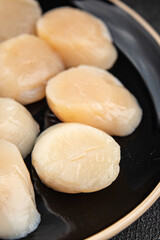 Sea scallop raw seafood fresh tasty food dish gourmet food background on the table rustic food top view copy space food pescetarian diet