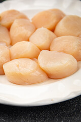 Sea scallop raw seafood fresh tasty food dish gourmet food background on the table rustic food top view copy space food pescetarian diet