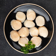 Sea scallop raw seafood fresh tasty food dish gourmet food background on the table rustic food top view copy space food pescetarian diet