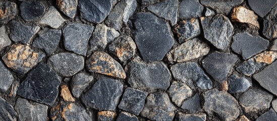 Close-up of natural stone wall texture with varying sizes and shapes