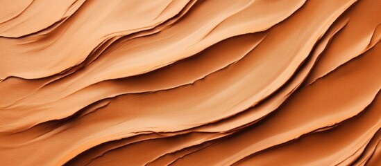 Obraz premium Abstract layers of textured orange clay with wavy pattern
