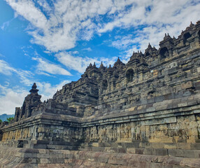 Borobudur Temple, Magelang. Ancient Stone Reliefs carving Depict Serene Buddha Figures and Narrative Scenes at Historic Temple, Masterful Carving Techniques and Spiritual Significance