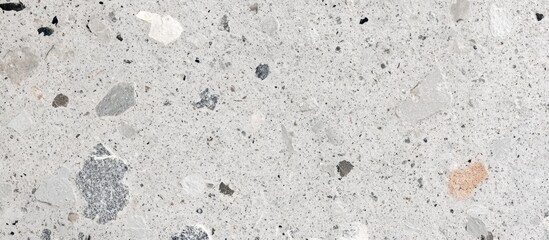 Concrete surface texture with various aggregate stones and gray tones