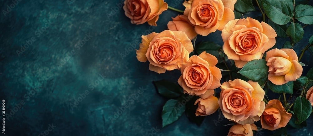 Poster peach roses with green leaves arranged on a dark textured background with copy space for text.