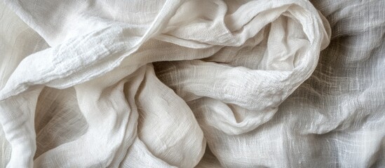 Textured white linen fabric background with soft folds and wrinkles suitable for textile and fabric design. Copy Space