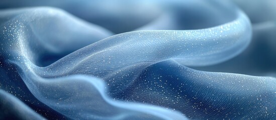 Obraz premium Blue sheer fabric texture with shimmering elements in soft folds and waves. Copy Space