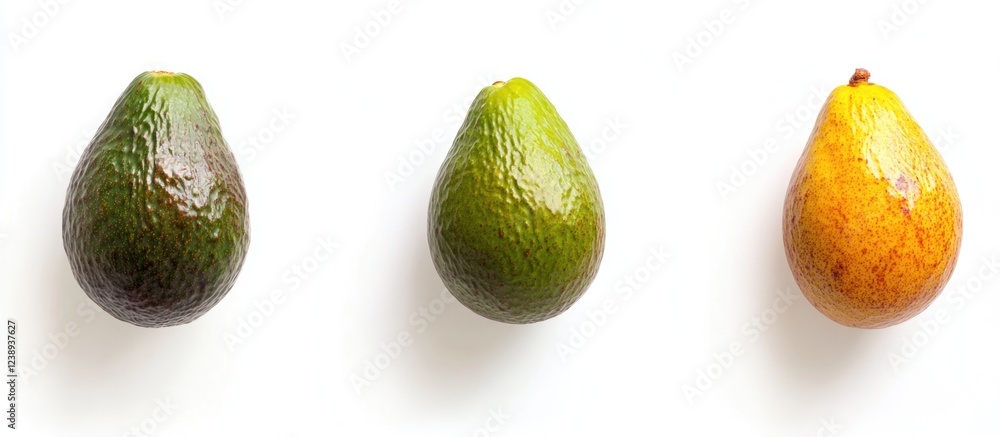 Aufkleber three ripe avocados in various colors arranged in a row on a white background with copy space
