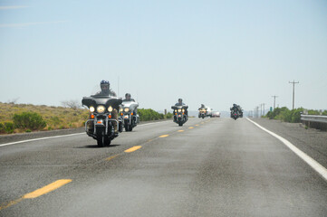 Willams, Arizona, USA. May 01, 2012: Motorcyclists ride on Route 66 in Williams, Arizona, under a clear blue sky.