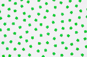 St Patricks Day background with green quatrefoils on the white background