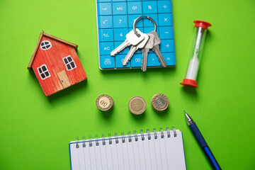 House model, coins, keys. Real estate