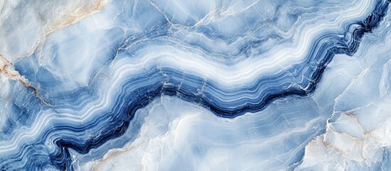 Blue agate stone texture background with wavy lines and layers of natural mineral formations. Copy Space