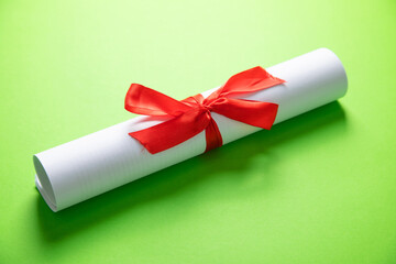 Diploma on the green background. Education