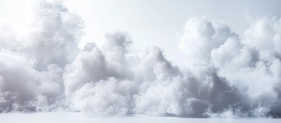 Fluffy white clouds in a bright sky with soft light providing a serene atmosphere and ample copy space for text placement.