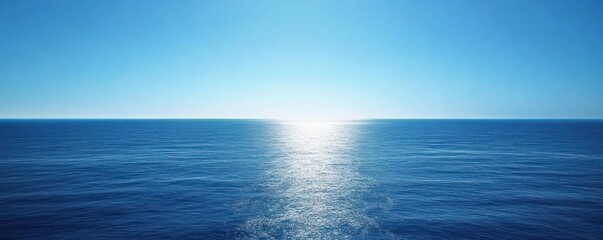 Obraz premium Deep blue ocean stretching to the horizon with a calm, serene sky above