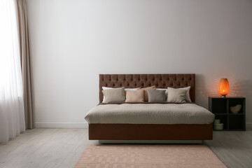 Cozy bedroom interior with mocha mousse shade. Trendy color of 2025 year