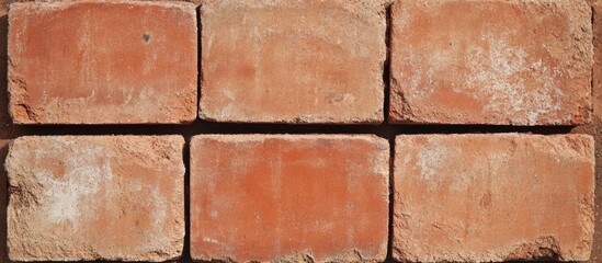 Obraz premium Red brick wall texture background with rough surface and natural weathering details. Copy Space available for text insertion.