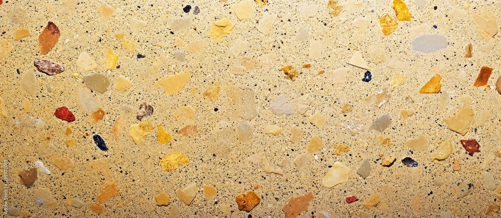 Aufkleber Colorful textured surface of gravel and stones on a flat background suitable for use in design with Copy Space