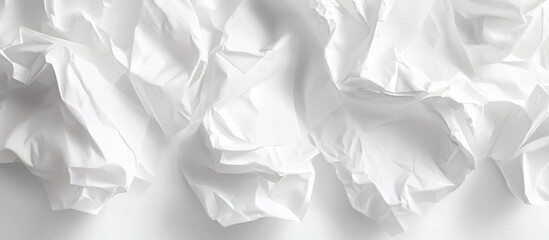 Crumpled white paper sheets on a light background with soft shadows and texture details providing ample copy space for text placement